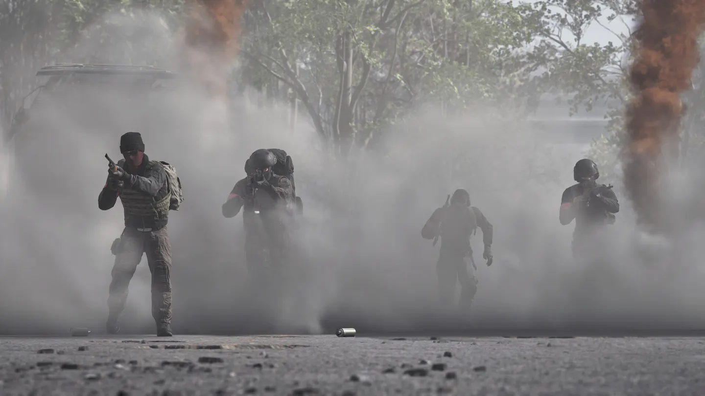 WARDOGS squad advancing together through smoke during a firefight